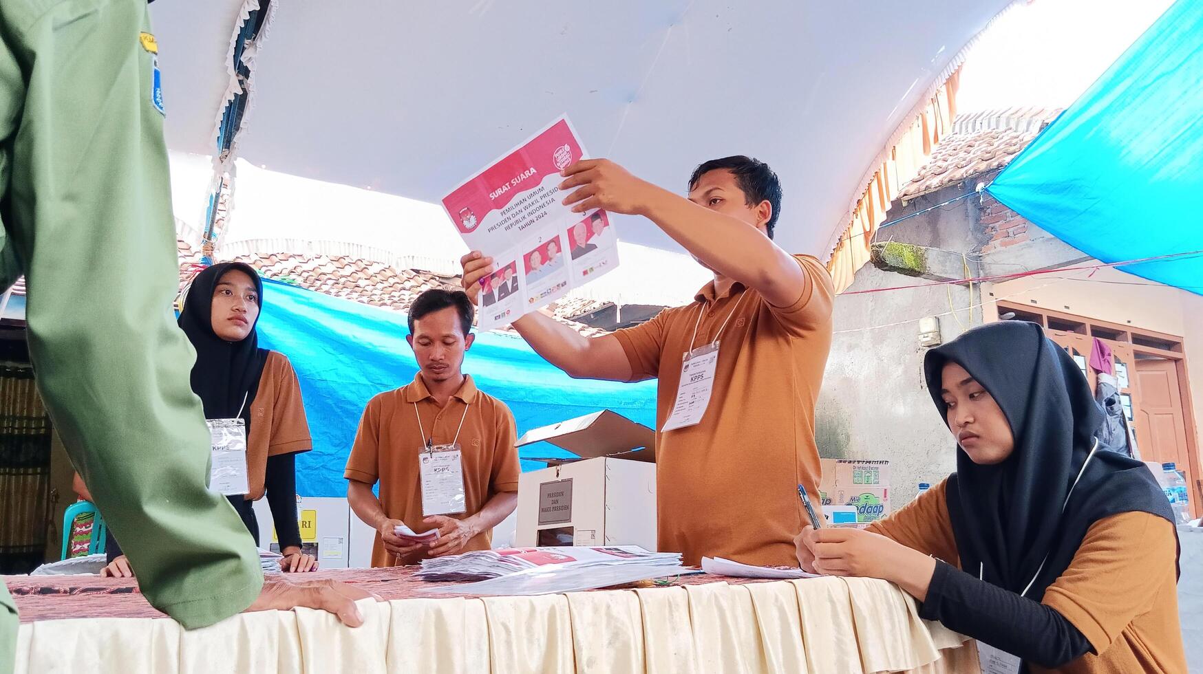 Demak, Indonesia - February, 2024 - Vote counting process at TPS, Indonesian presidential election. photo