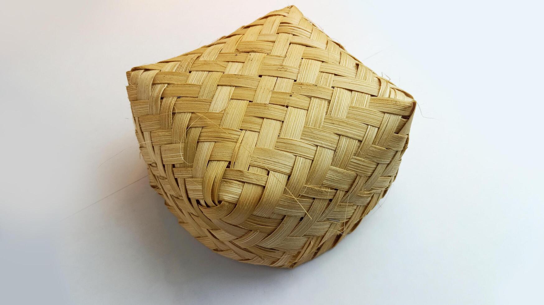 Besek or woven bamboo is a traditional food box made of woven bamboo photo