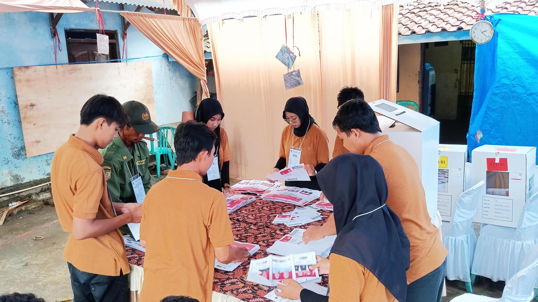 Demak, Indonesia - February, 2024 - Vote counting process at TPS, Indonesian presidential election. photo