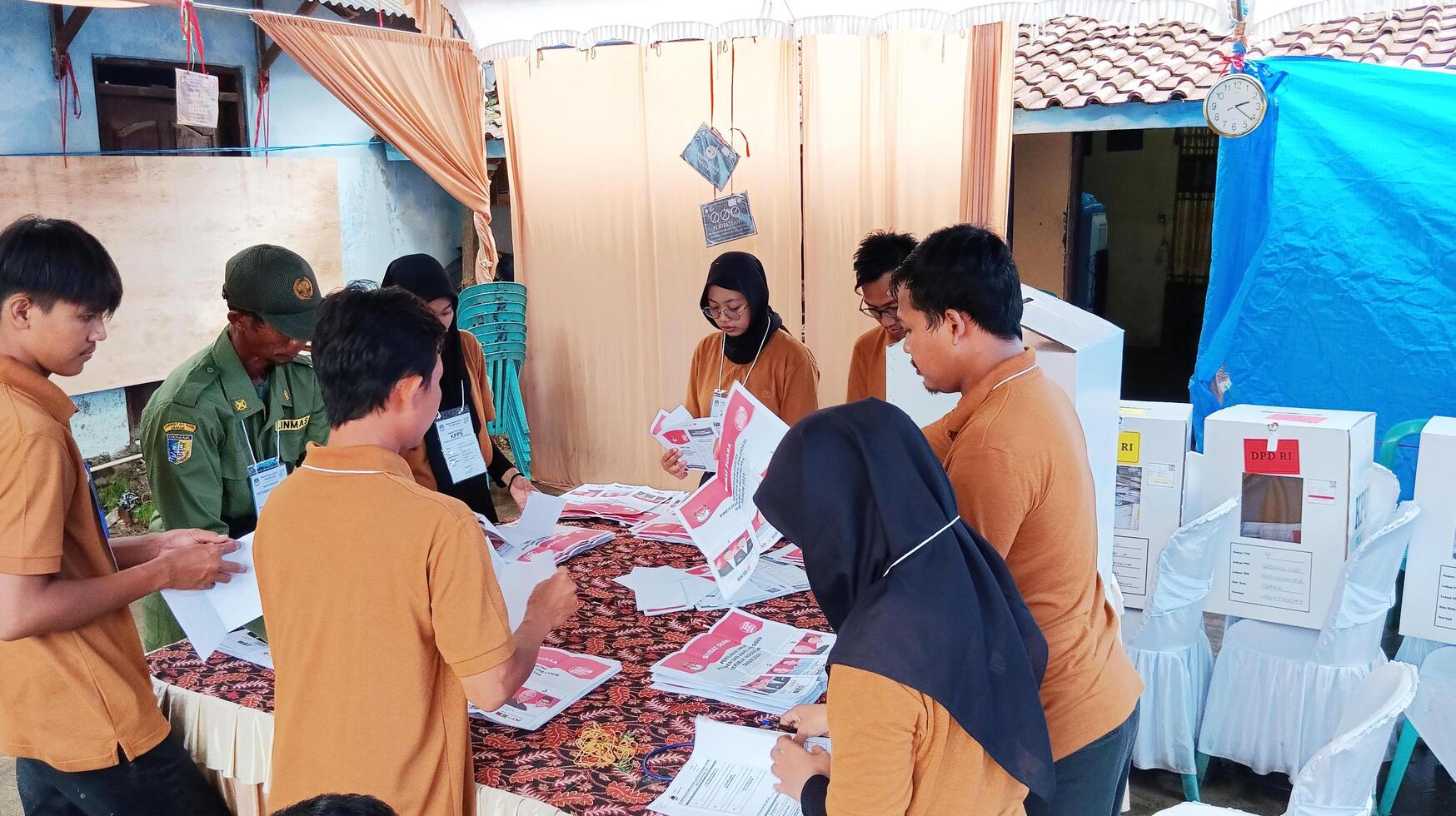 Demak, Indonesia - February, 2024 - Vote counting process at TPS, Indonesian presidential election. photo