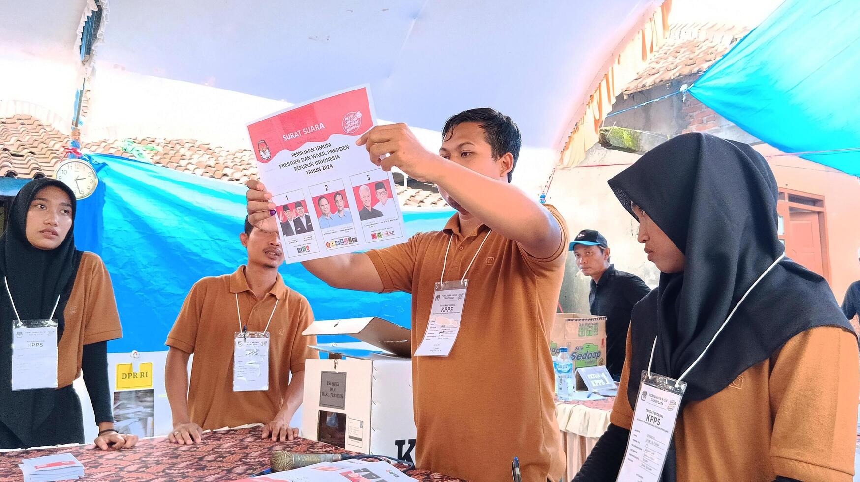 Demak, Indonesia - February, 2024 - Vote counting process at TPS, Indonesian presidential election. photo