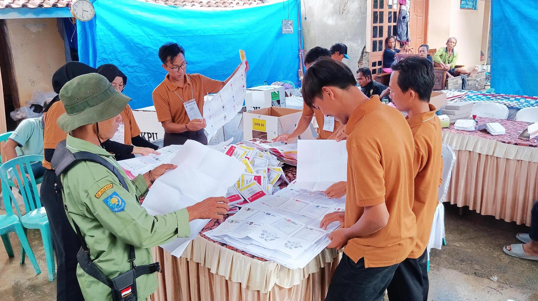 Demak, Indonesia - February, 2024 - Vote counting process at TPS, Indonesian presidential election. photo