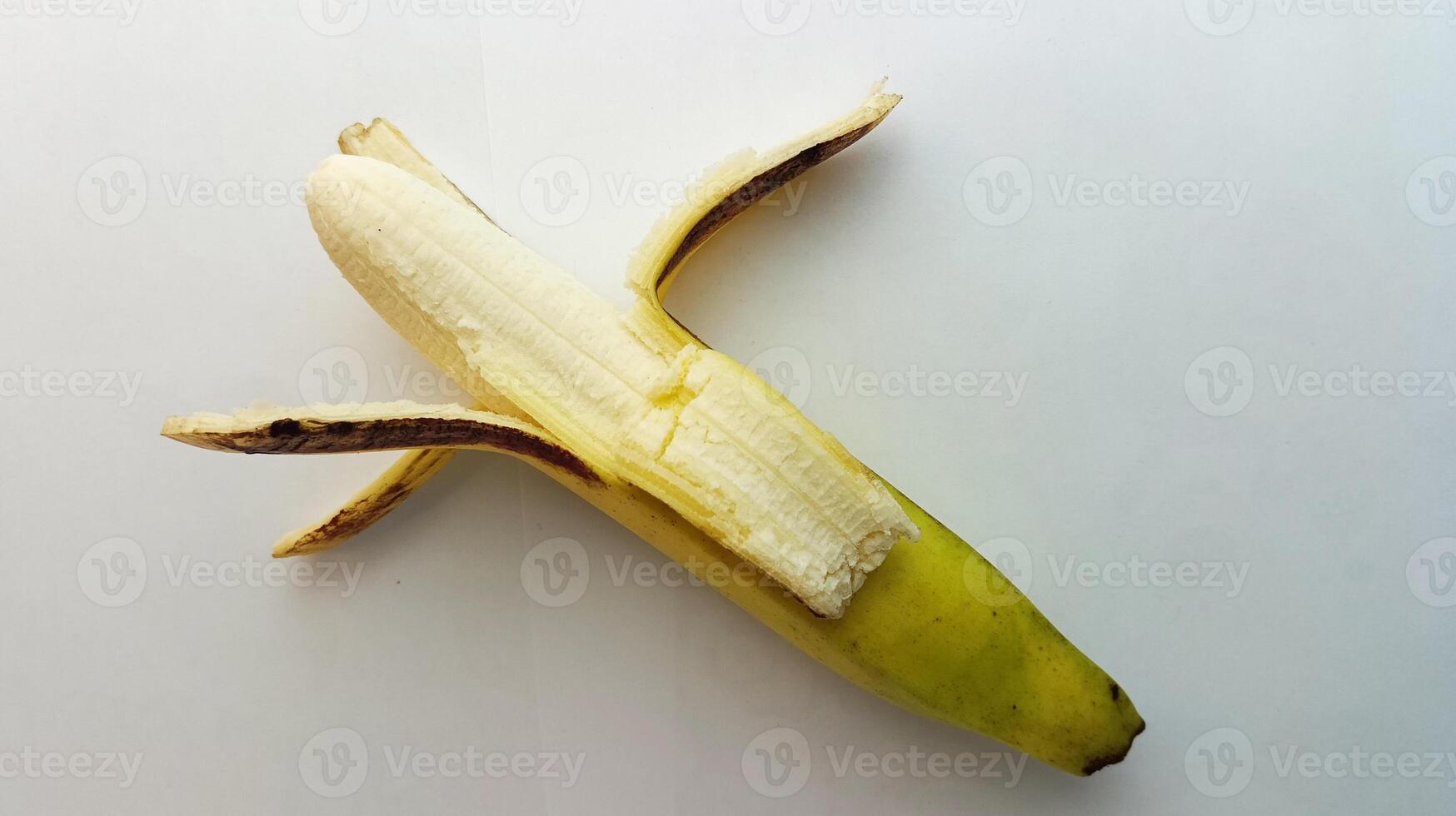 opened yellow banana on a white background photo