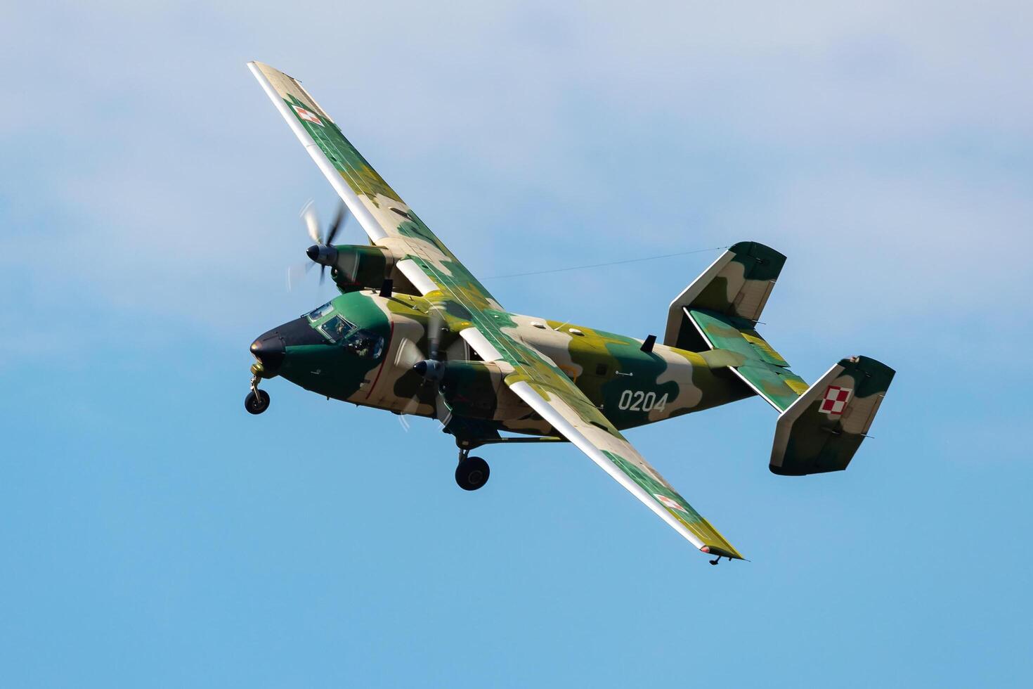 Radom, Poland, 2023 - Polish Air Force PZL M28 Bryza transport plane flying. Aviation and military aircraft. photo