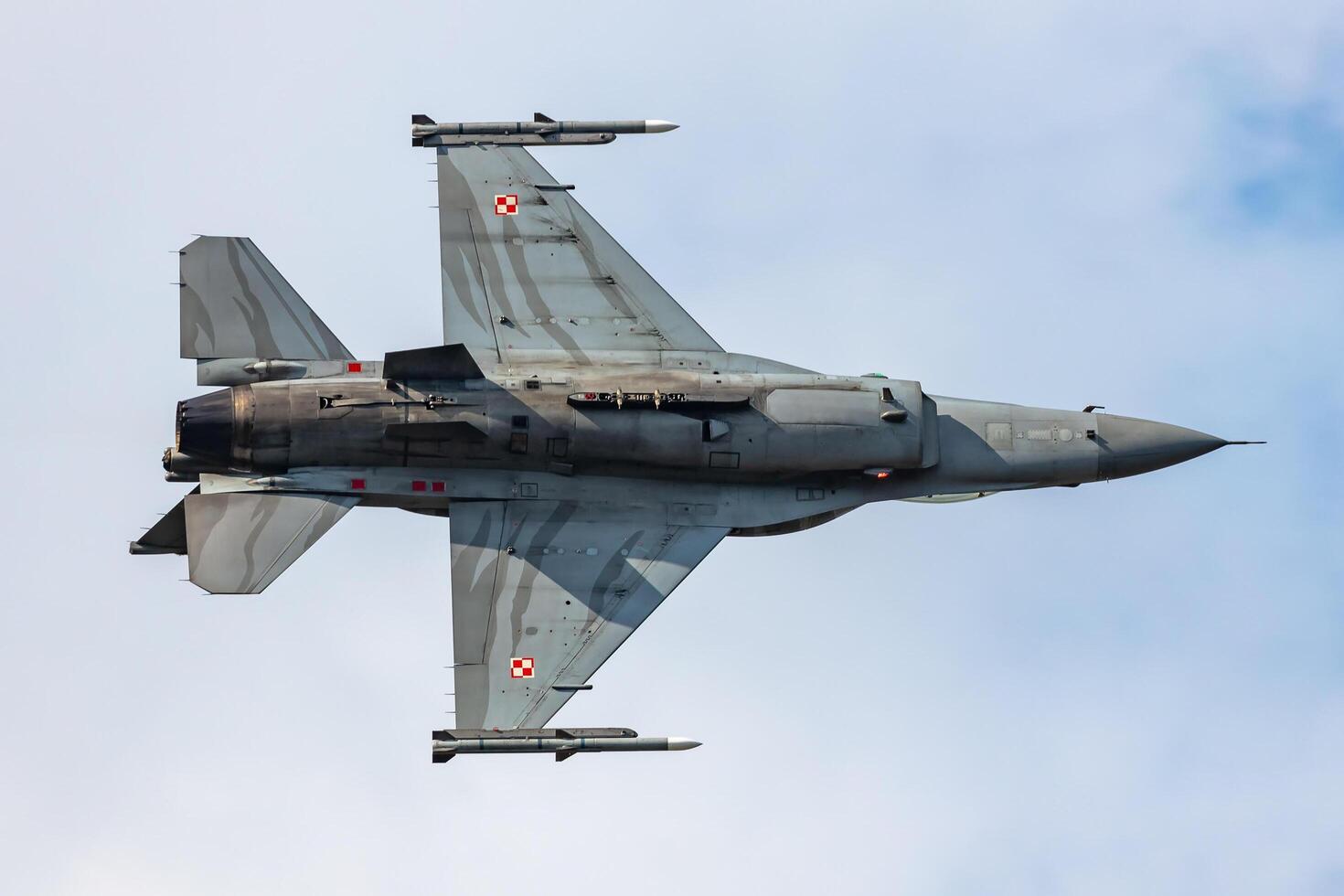 Radom, Poland, 2023 - Polish Air Force Lockheed F-16 Fighting Falcon fighter jet plane flying. Aviation and military aircraft. photo