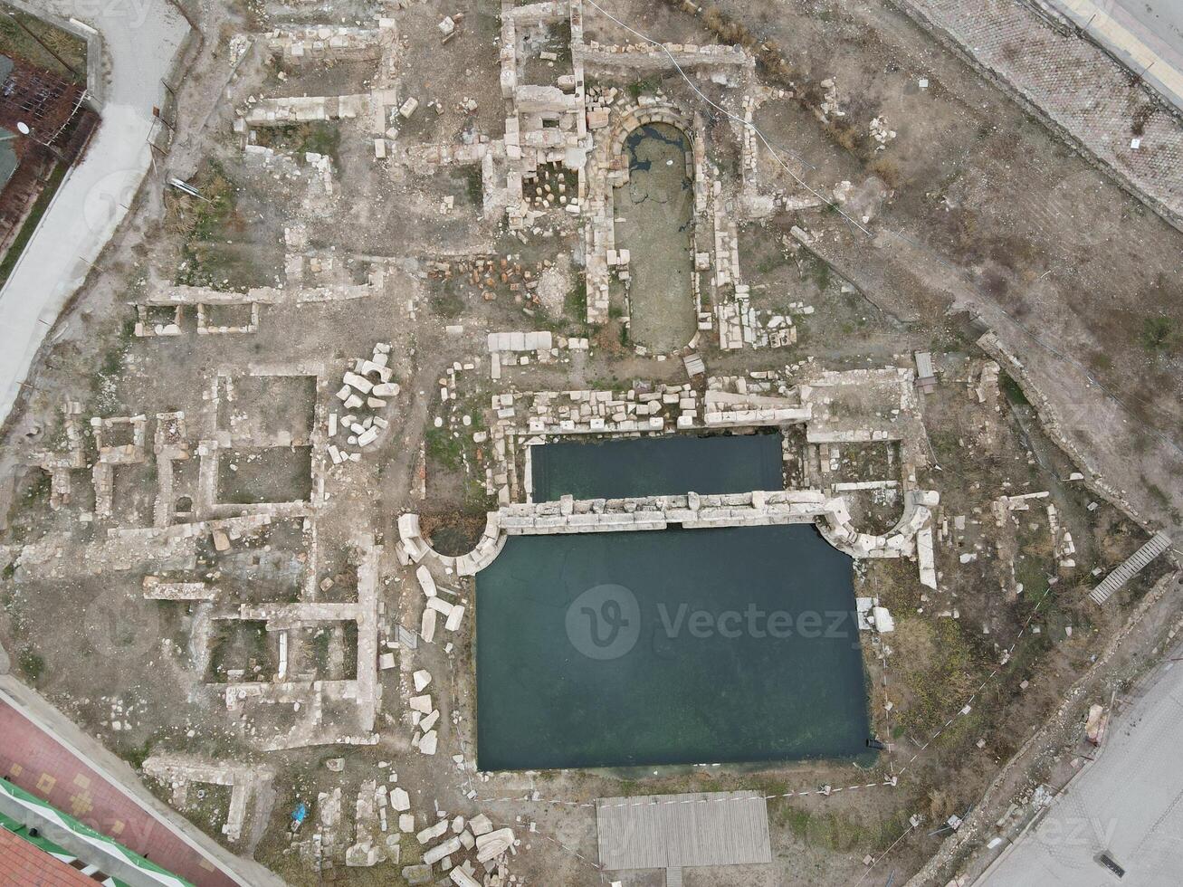 Basilica Therma is an ancient Roman spa town located in the Yozgat province of Turkey. Drone shooting on a snowy day photo