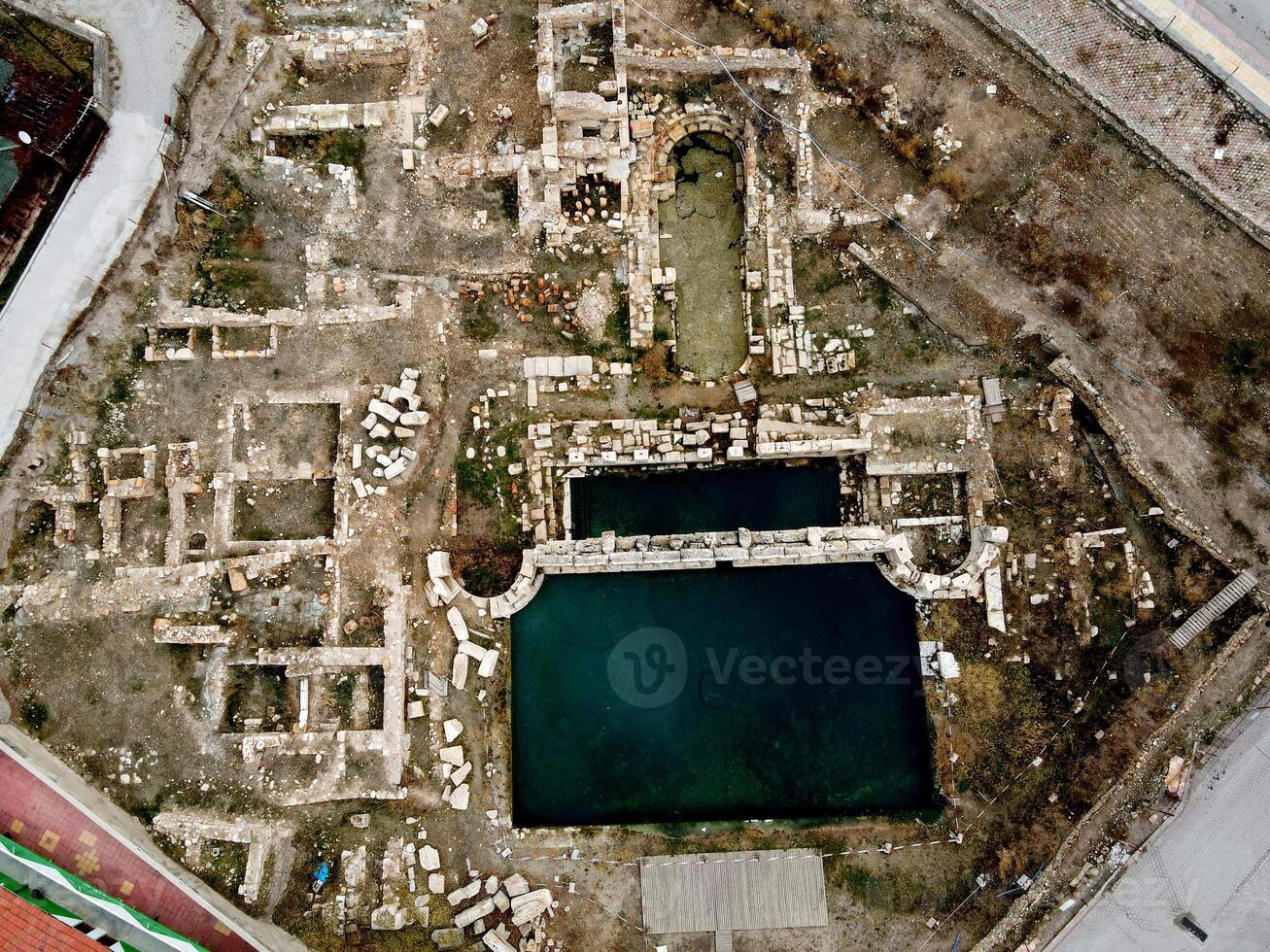 Basilica Therma is an ancient Roman spa town located in the Yozgat province of Turkey. Drone shooting on a snowy day photo