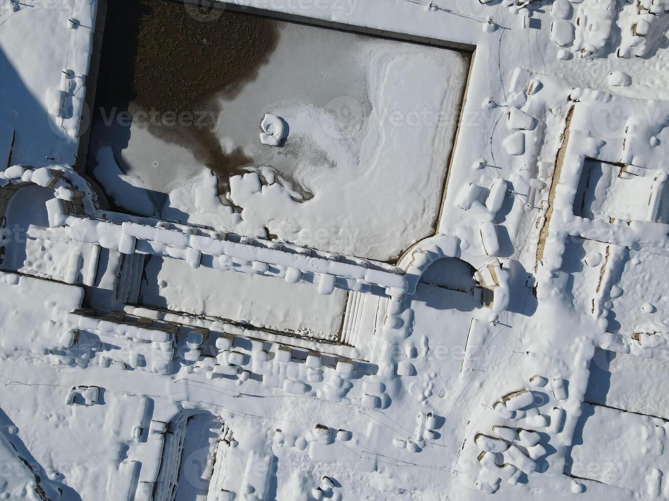 Basilica Therma is an ancient Roman spa town located in the Yozgat province of Turkey. Drone shooting on a snowy day photo