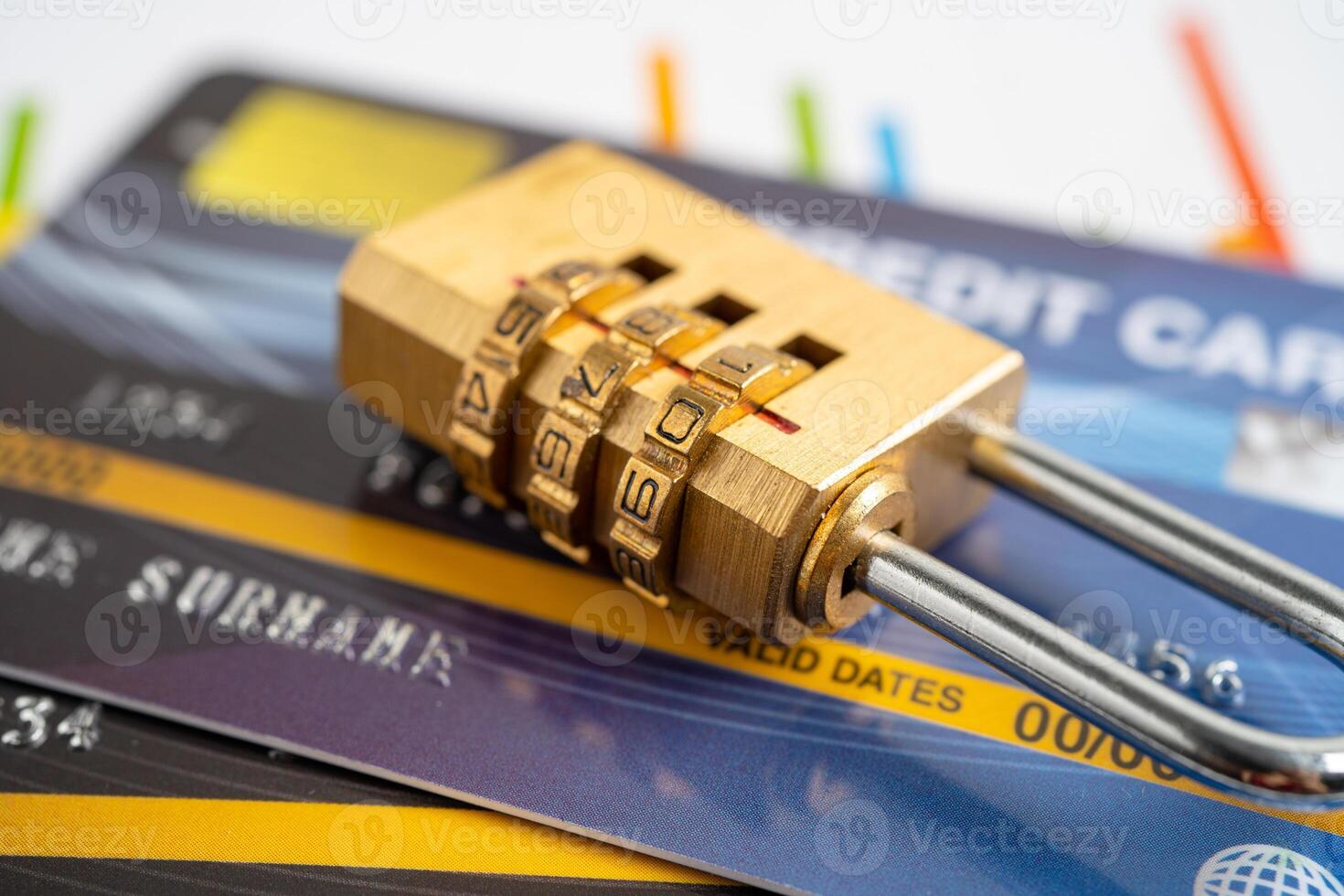 Credit card with password key lock and US dollar banknotes. photo