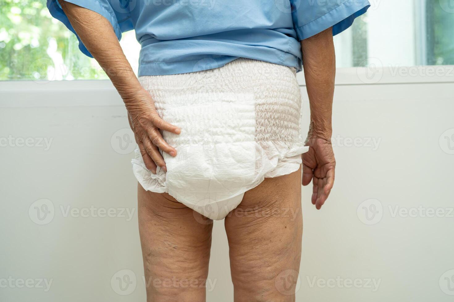 Asian senior woman patient wearing incontinence diaper in hospital, healthy strong medical. photo