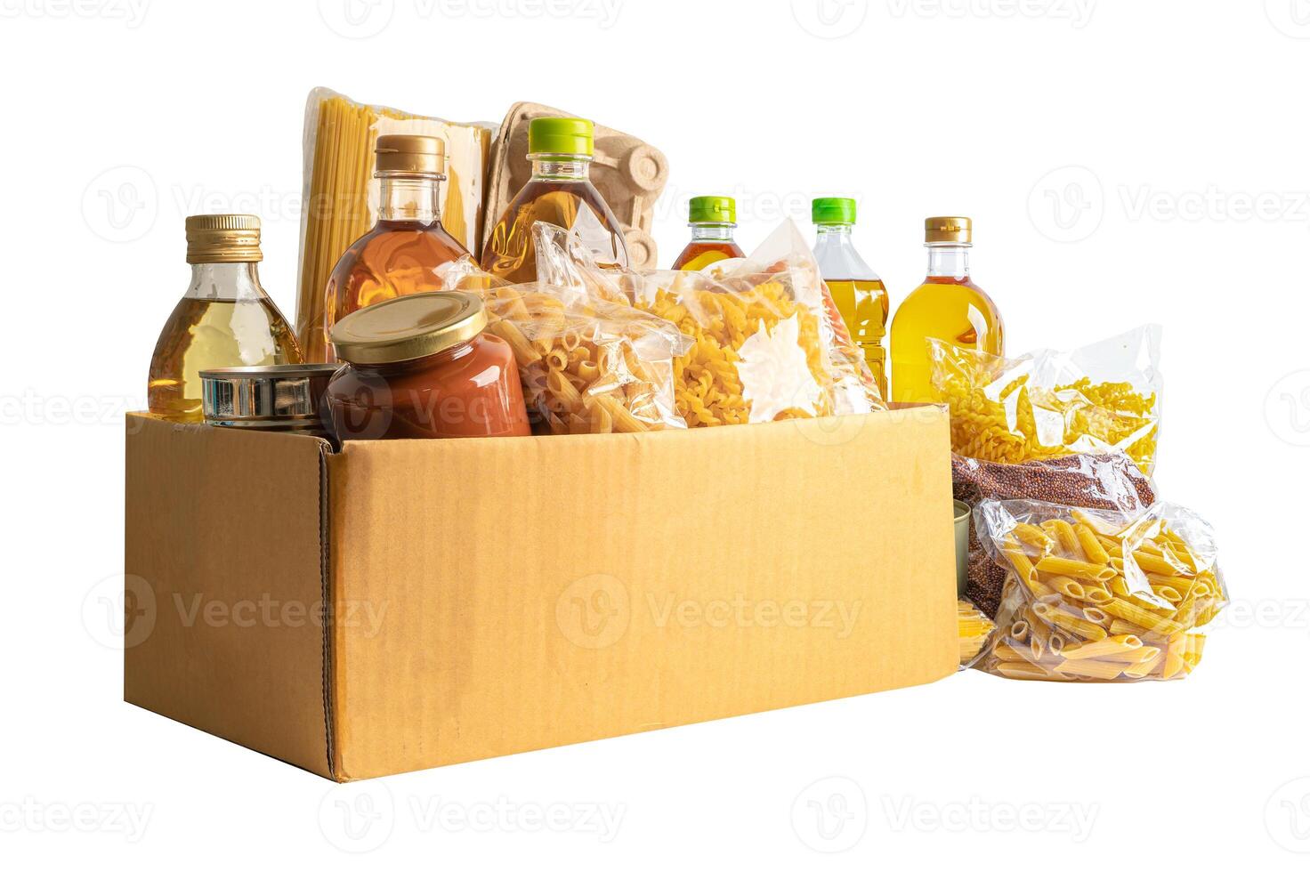 Foodstuff for donation isolated on white background, storage and delivery. Various food, pasta, cooking oil and canned food. photo