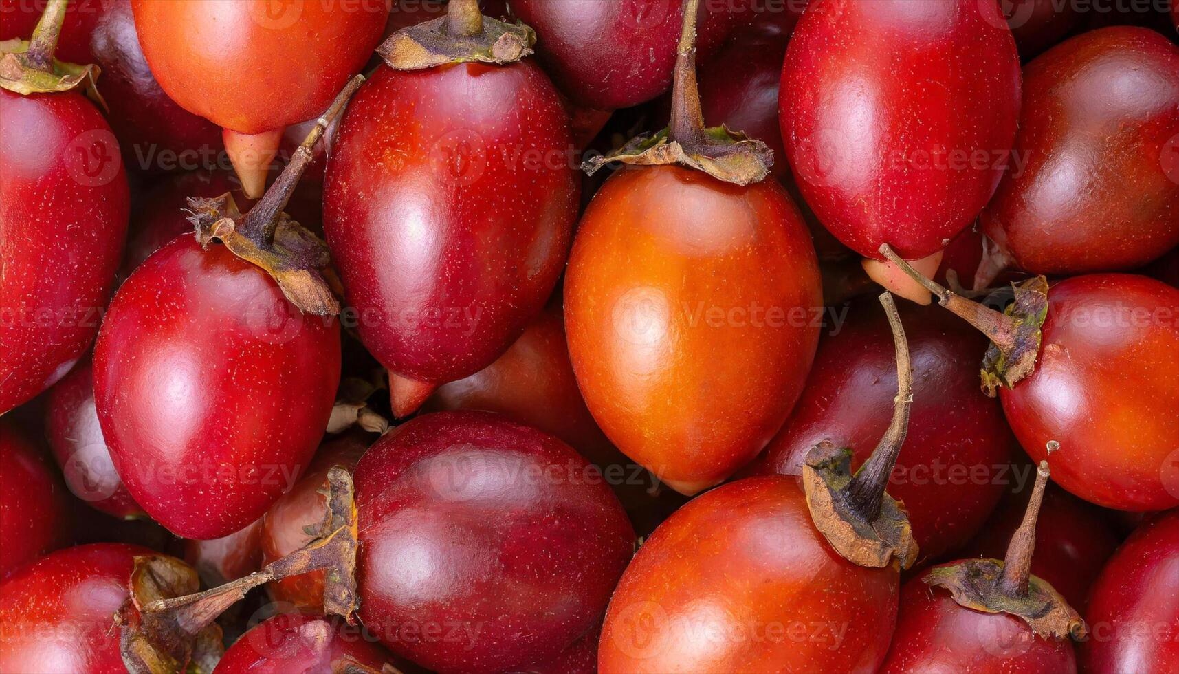 AI generated a close up of a bunch of red and orange tamarillo fruits photo