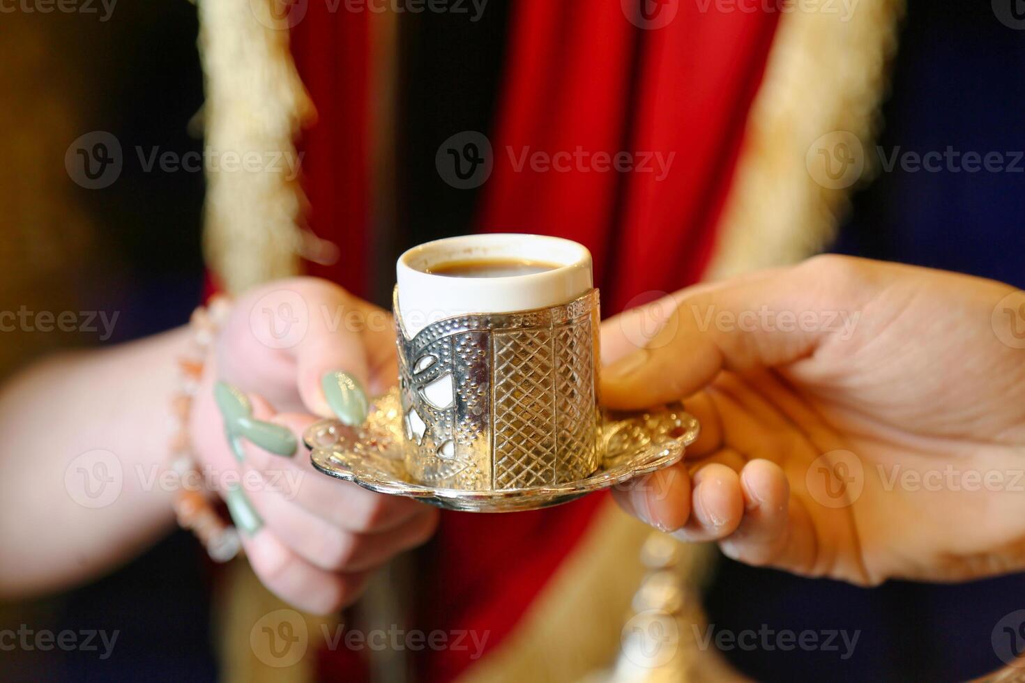 Close Up of a Person Holding a Cup of Coffee photo