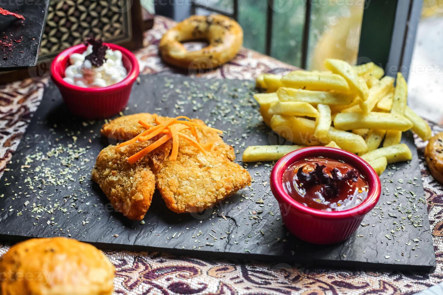 Tray of Food With Fried Chicken, Fries, and Dips photo
