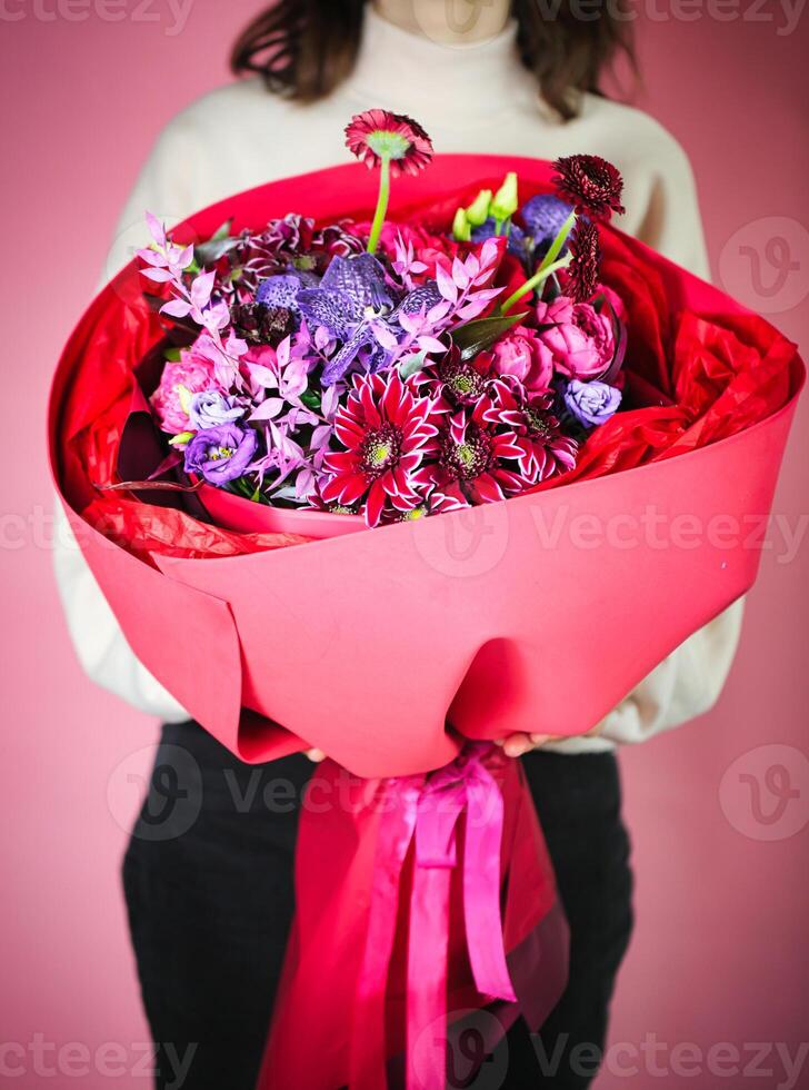 Woman Holding Bouquet of Flowers photo