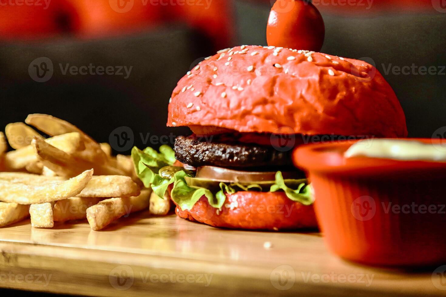 Delicious Hamburger and Fries on Wooden Table photo