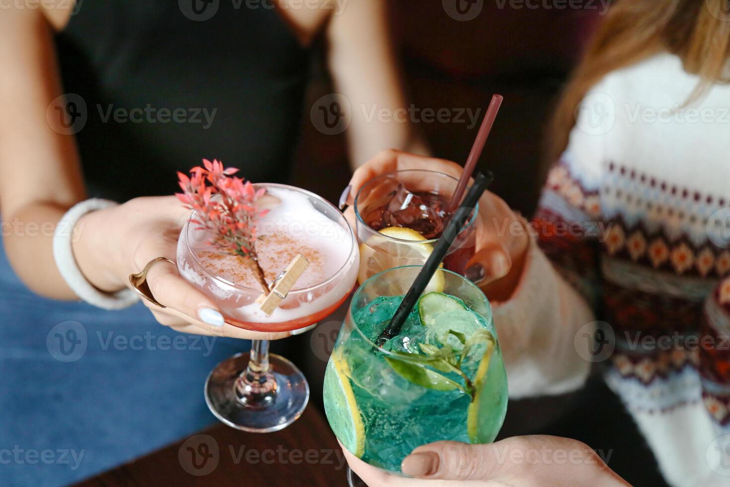Group of People Holding Drinks at a Social Gathering photo