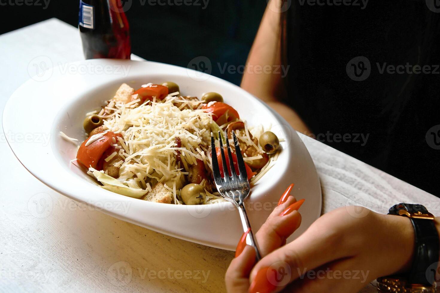 Person Holding Fork and Bowl of Food photo