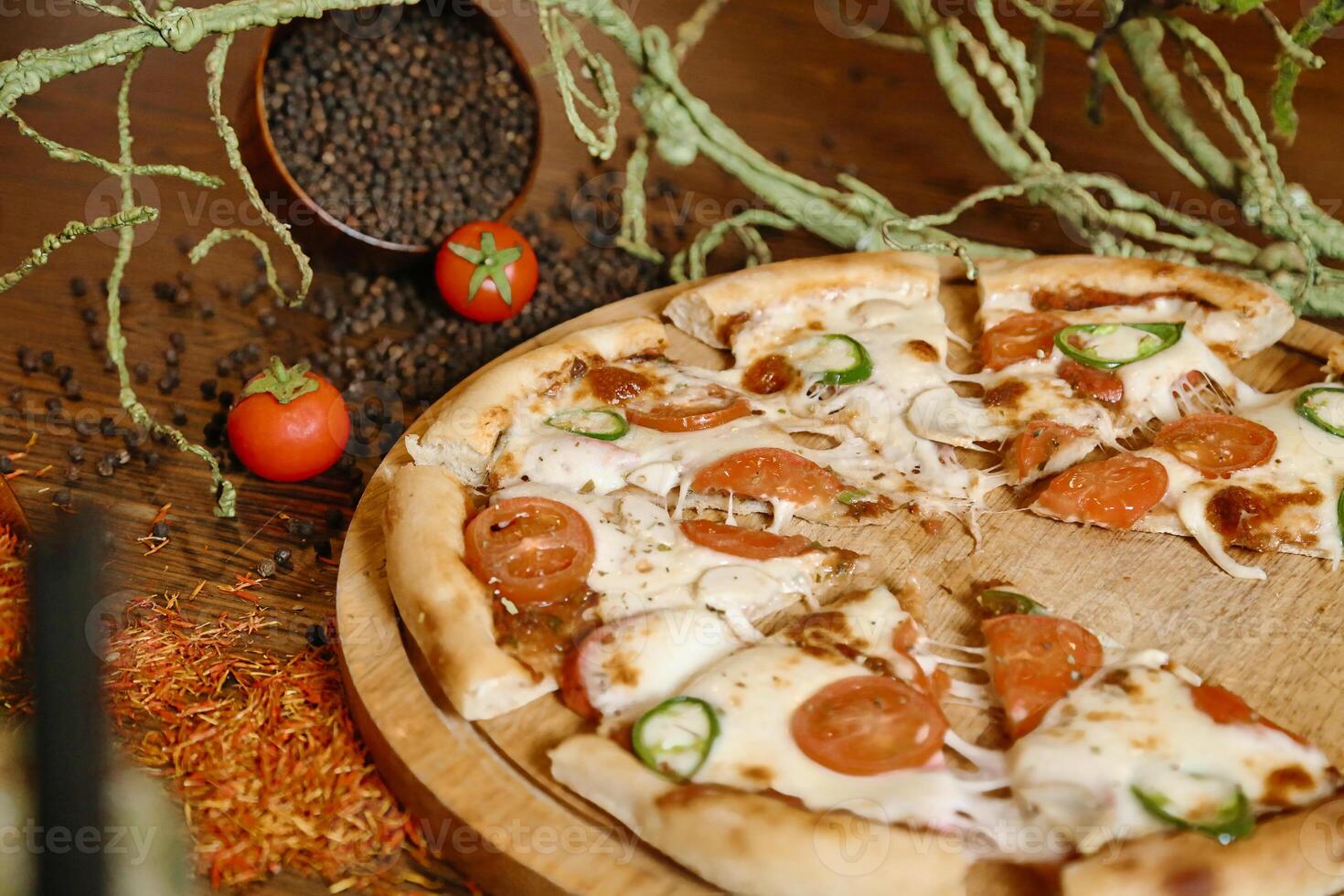 Pizza on Wooden Cutting Board photo