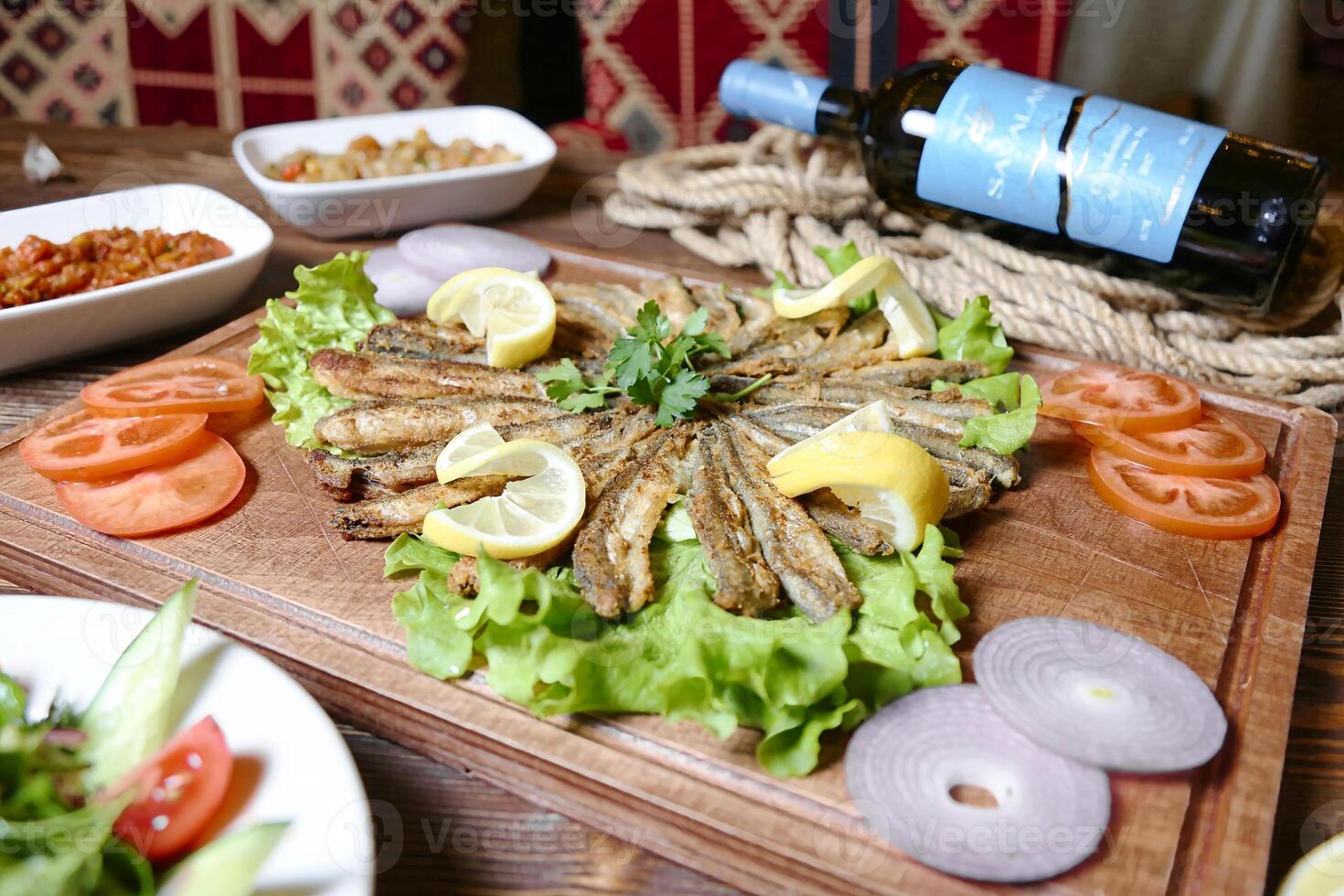 Abundant Wooden Cutting Board Topped With a Variety of Delicious Food. photo
