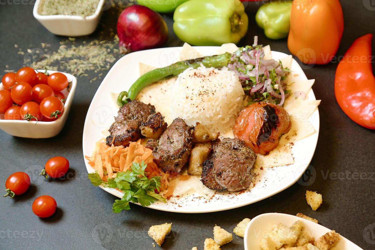 Plate of Meat and Vegetables on Table photo