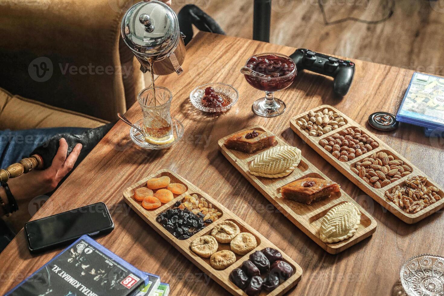 Abundant Spread Wooden Table Covered With Assorted Trays of Food photo