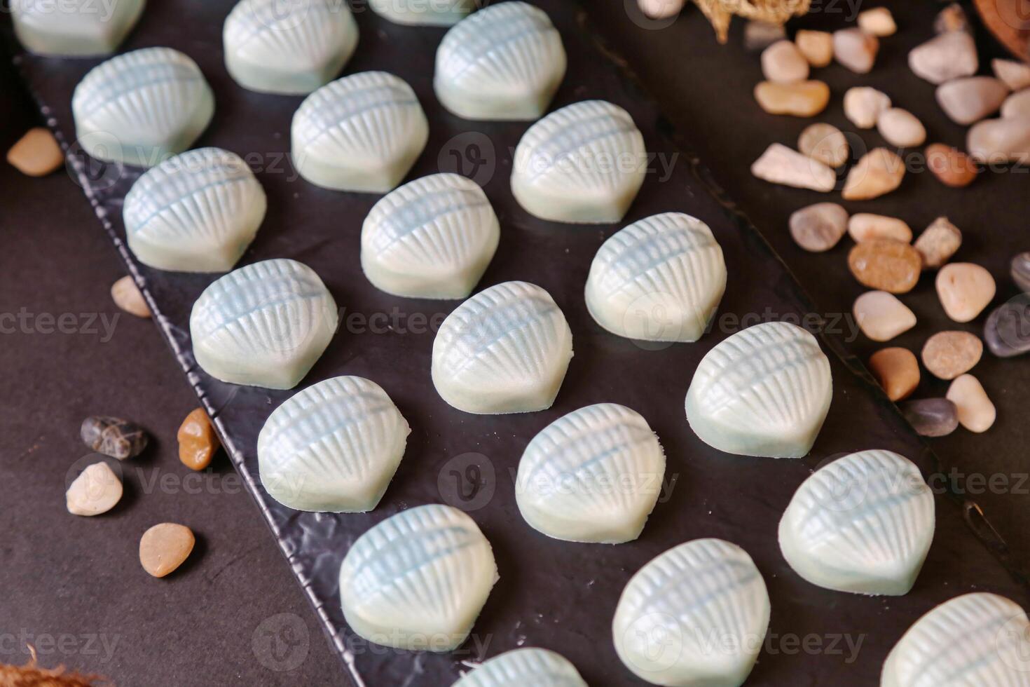 Close-Up of Tray of Chocolates on Table photo