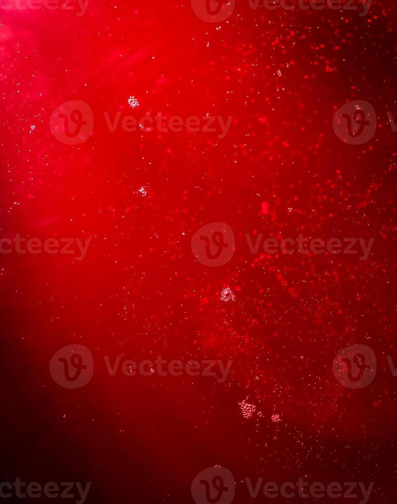 Red liquid with bubbles photo