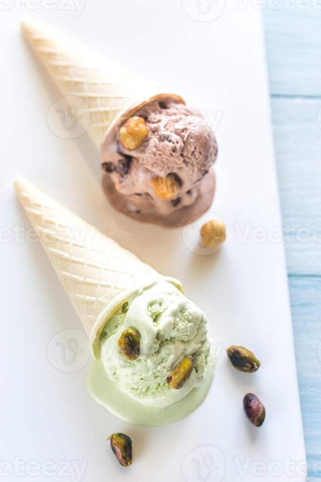 Two cones of nut-flavored ice cream photo
