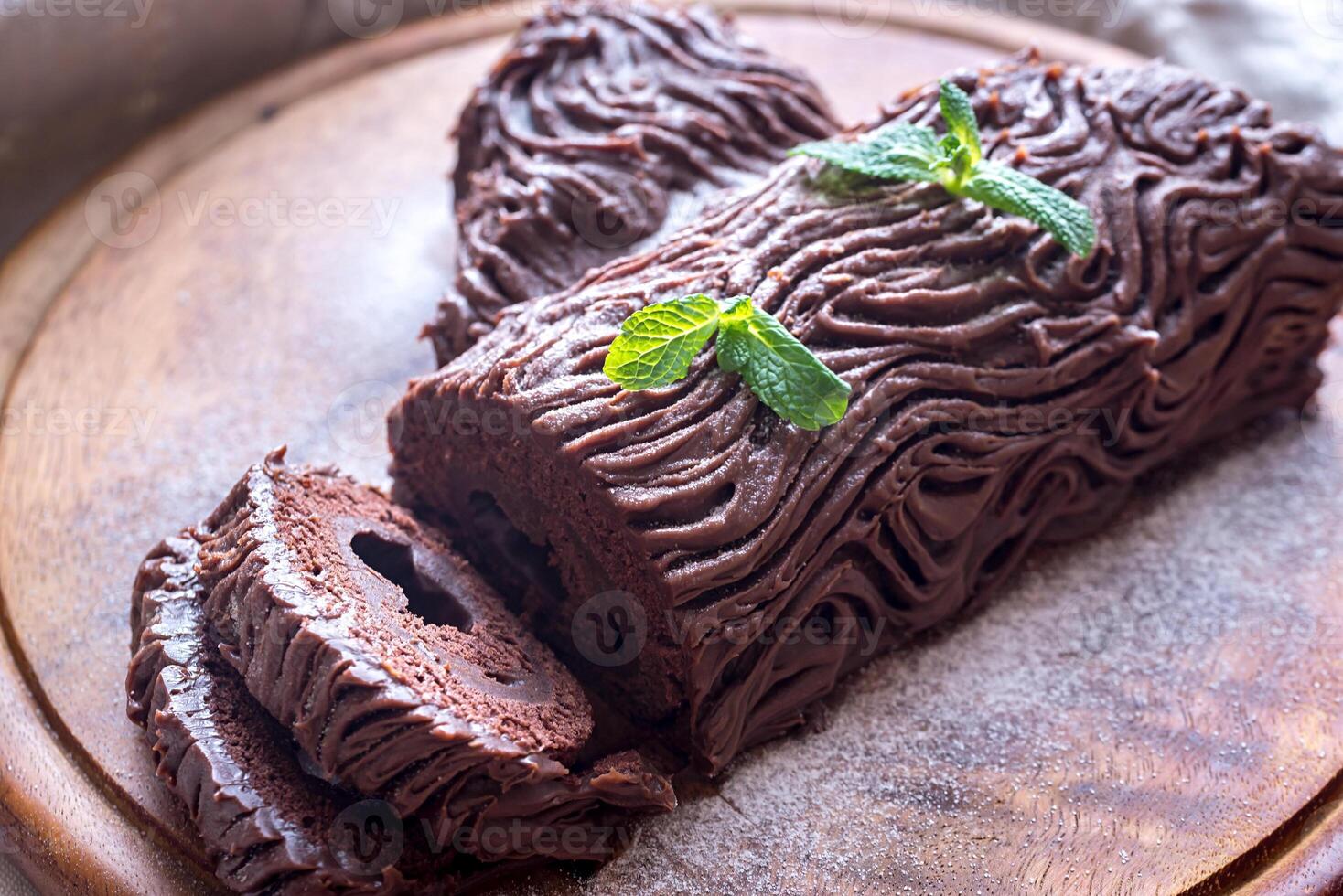 Yule log on the wooden board photo