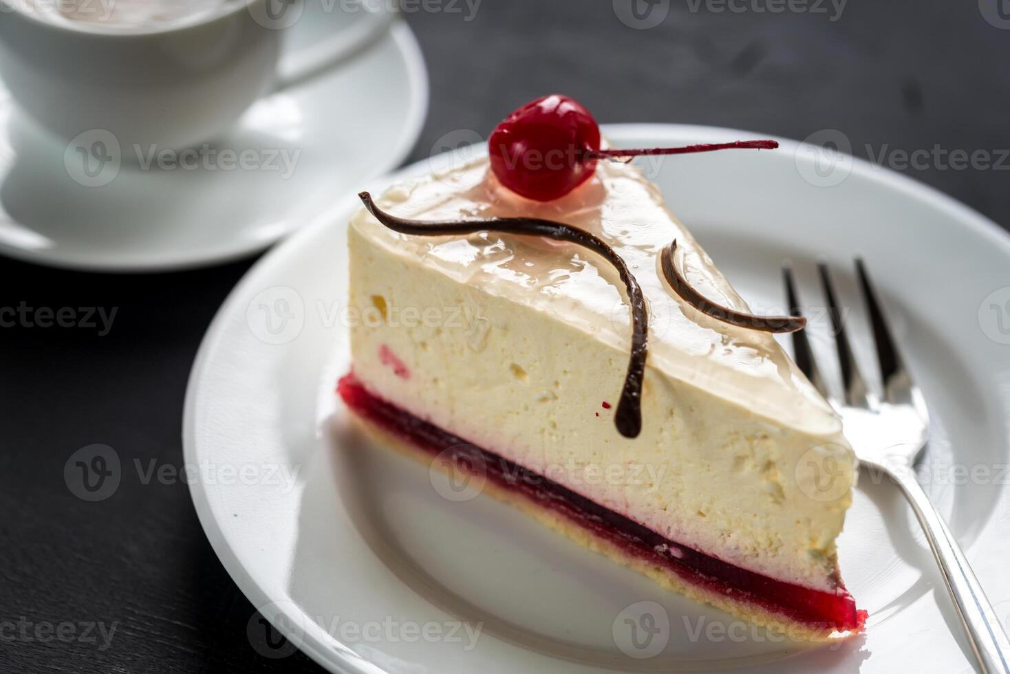 Raspberry cheesecake with sweet cherry photo