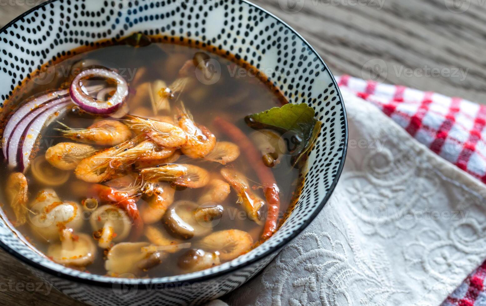 Bowl of thai tom yum soup photo