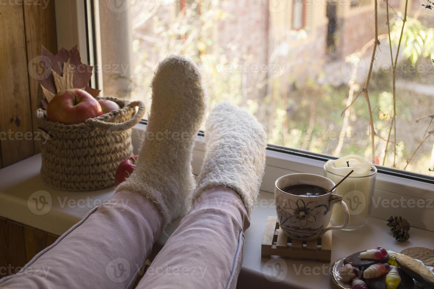 Woman relaxing with cup of coffee at home. photo