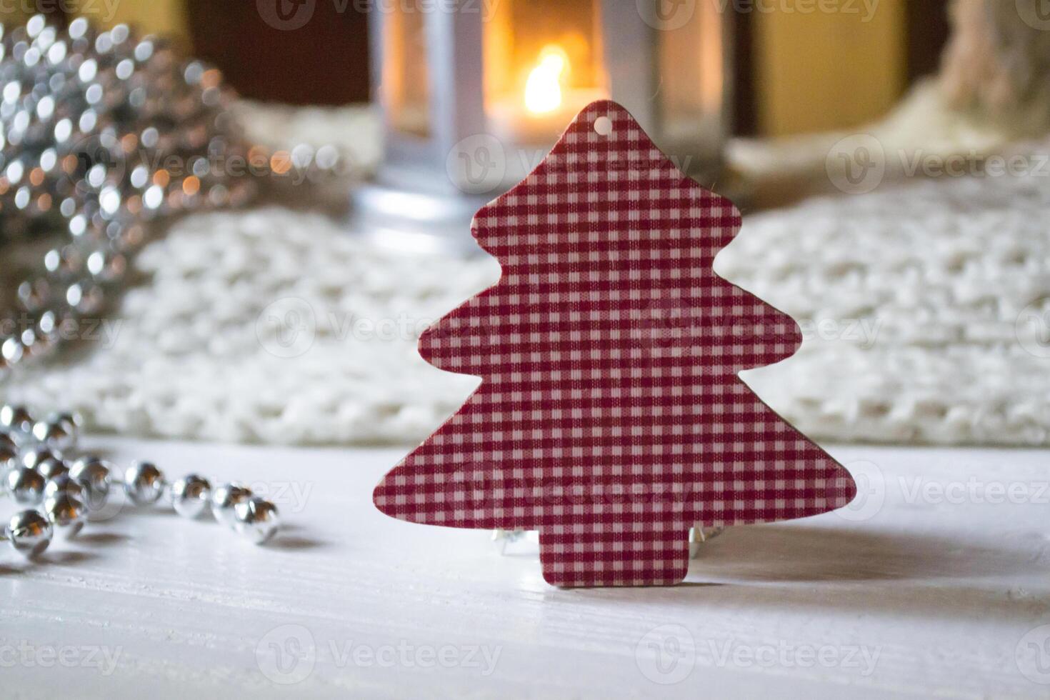 Burning candle and christmas decoration. photo