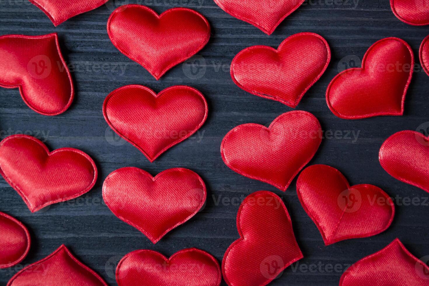 Red love hearts on a blue wooden background. Valentine's Day 2019. Background for greeting card. photo