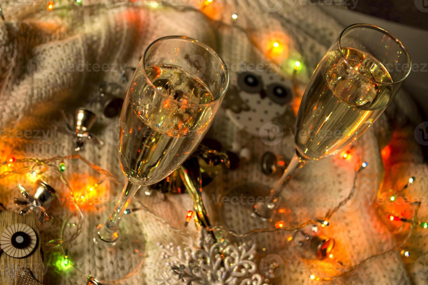 The glasses of champagne and christmas decoration. photo