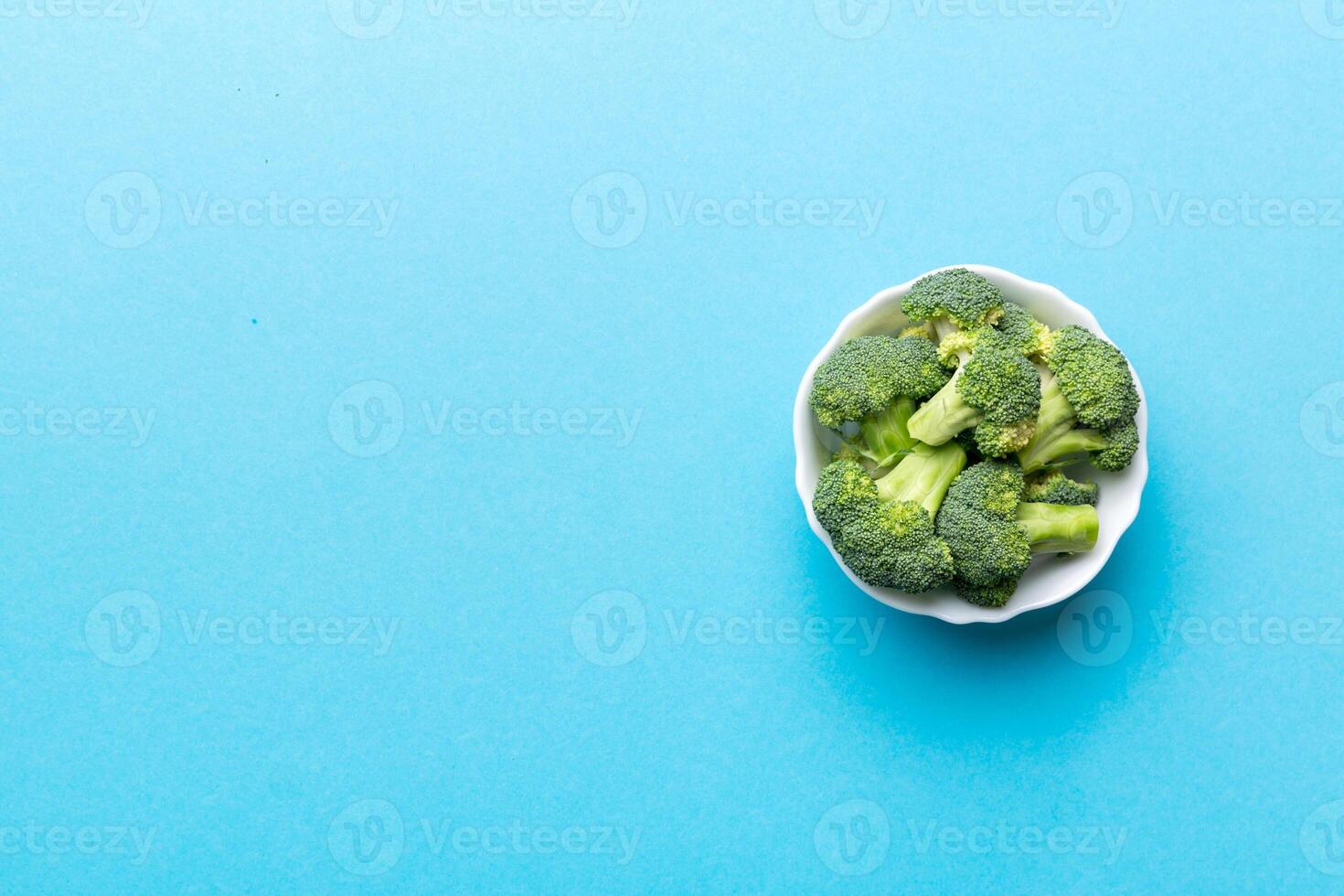 broccoli of fresh green broccoli in bowl over coloredbackground. , close up. Fresh vegetable photo