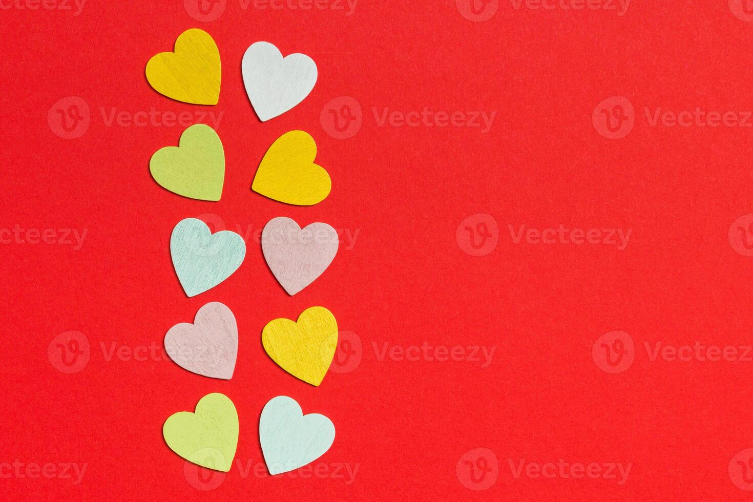 Top view of wooden hearts on colorful background with copy space. Romantic concept. St Valentine's Day photo