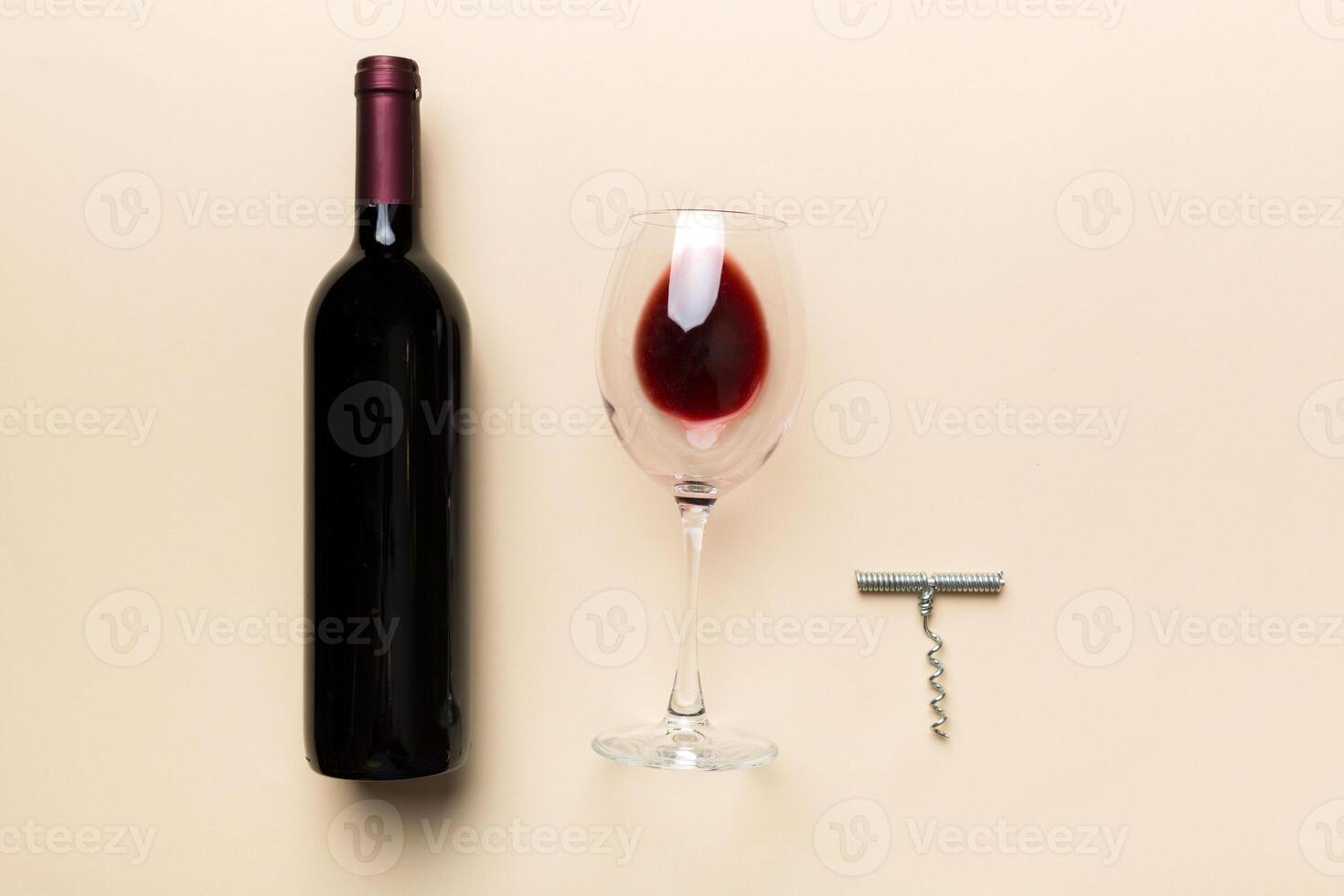 Flat lay composition with corkscrew, bottle of wine and elegant glass on colored table. Flat lay, top view wth copy space photo