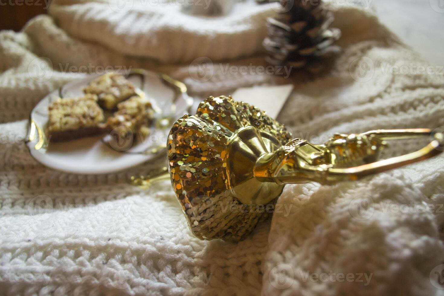 A cup of coffee, woolen sweater and Christmas decorations. Winter still life. photo