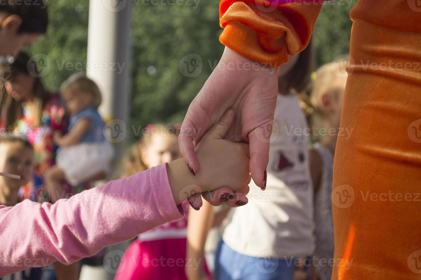 Mother and daughter holding hands. photo