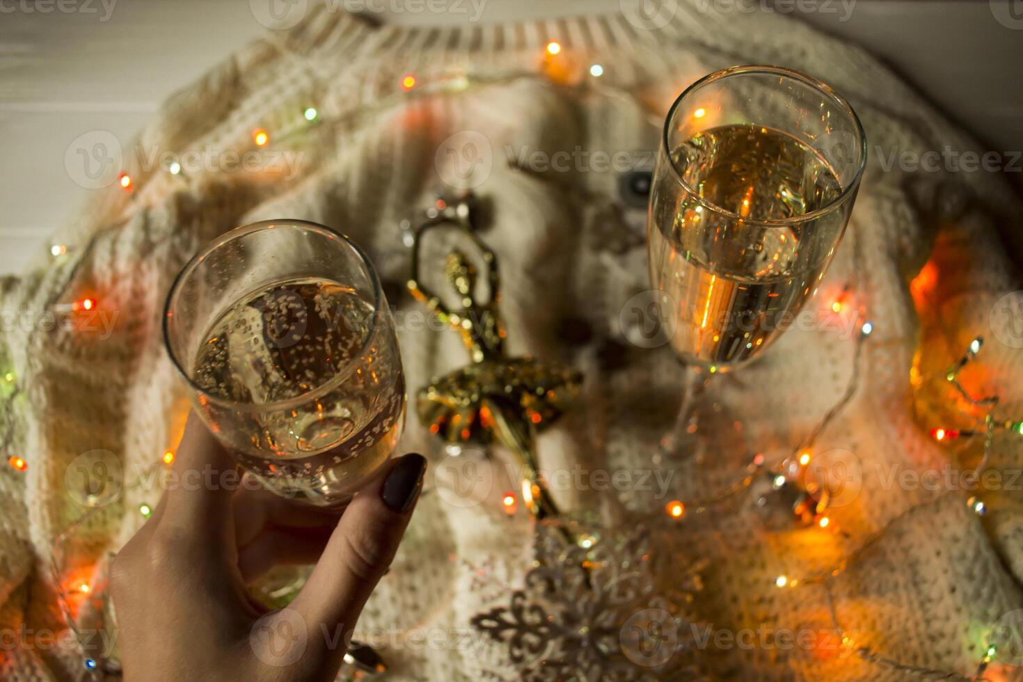 The glasses of champagne and christmas decoration. photo