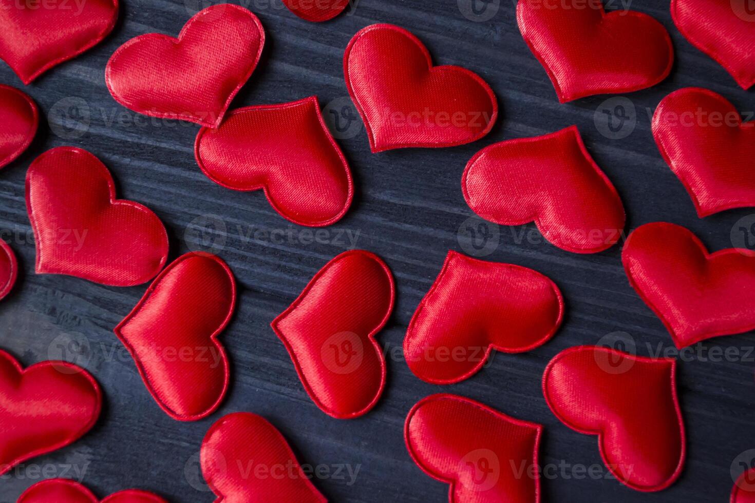 Red love hearts on a blue wooden background. Valentine's Day 2019. Background for greeting card. photo