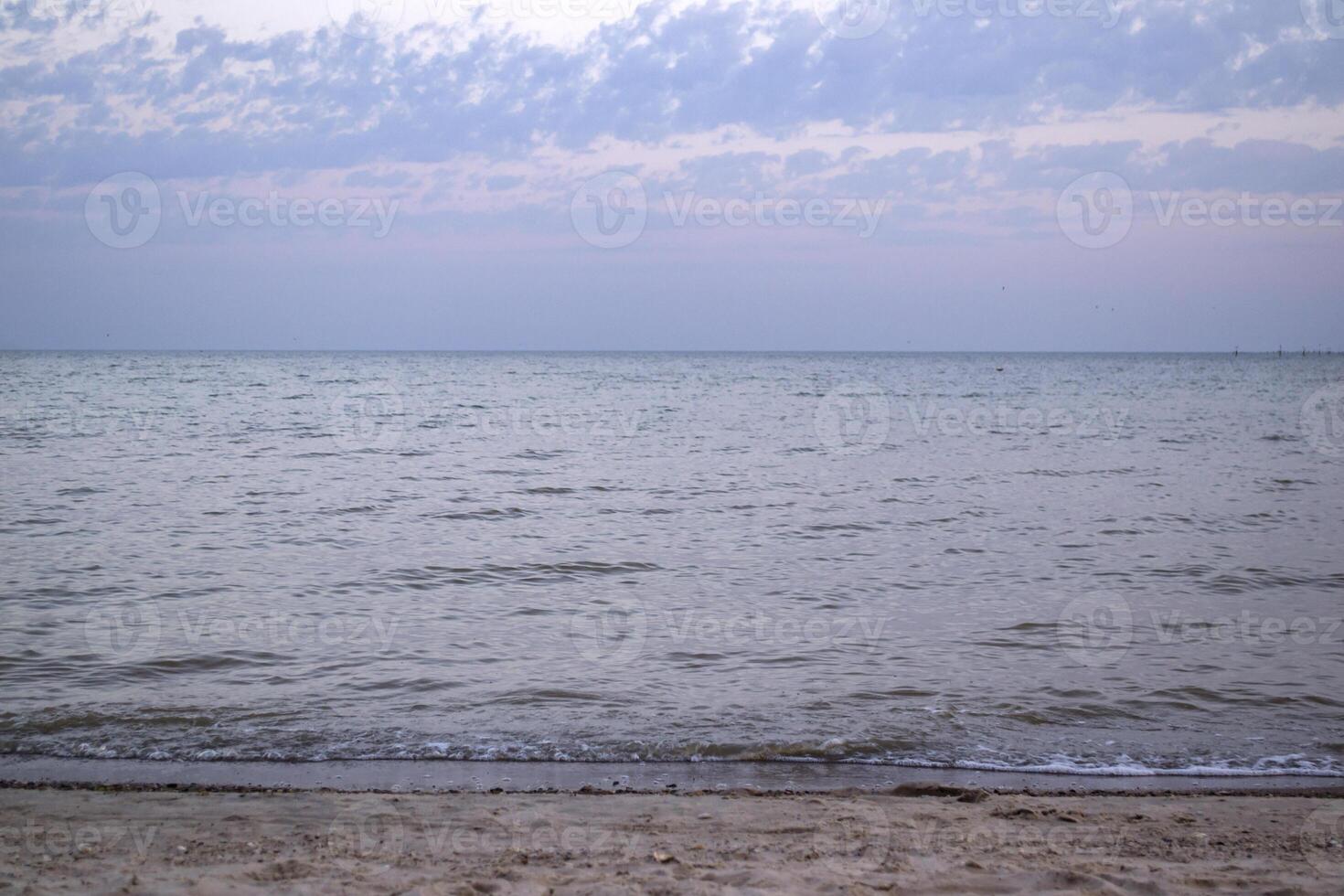 Beautiful sunset on the deserted beach. The place for rest and relaxation. photo