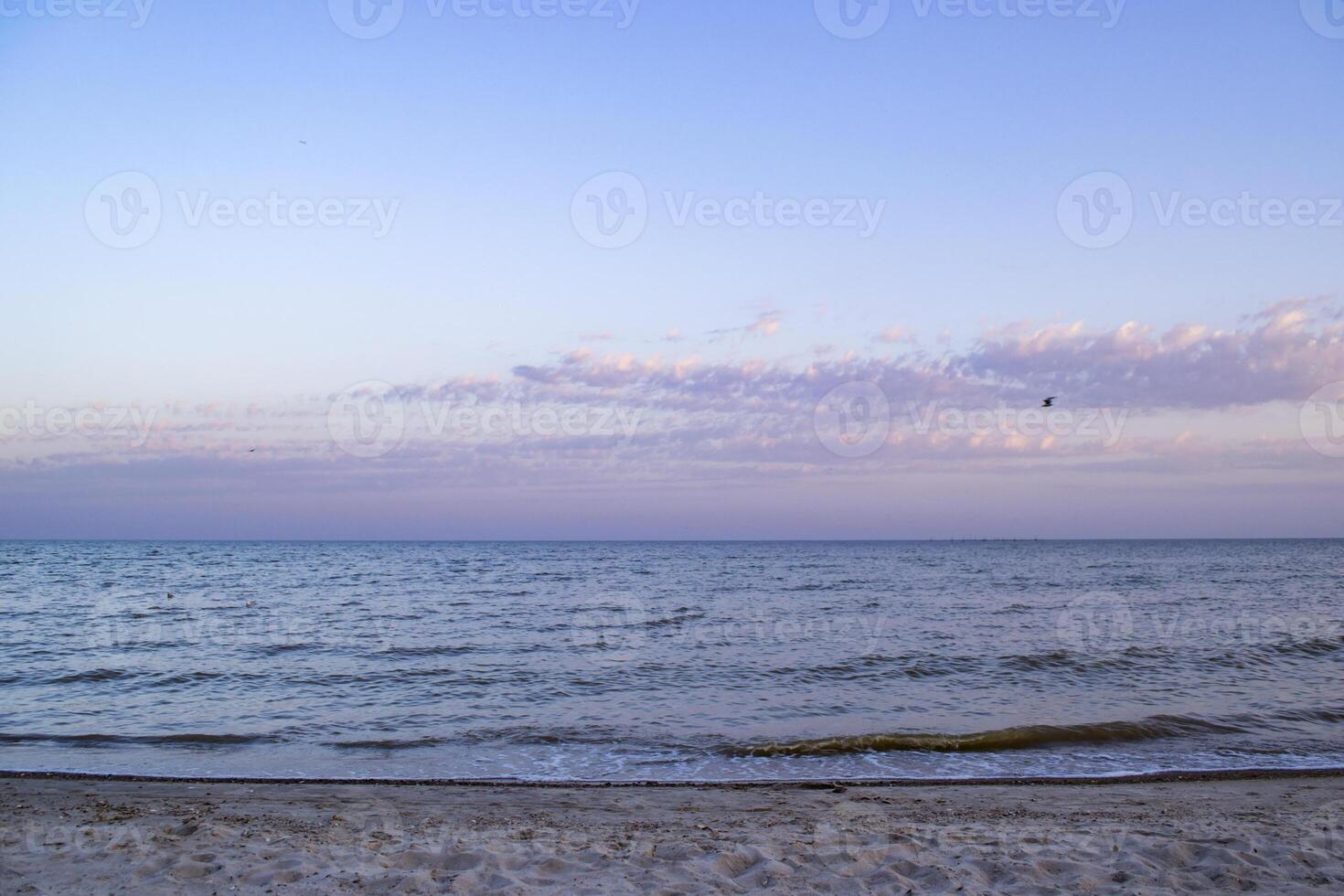 Beautiful sunset on the deserted beach. The place for rest and relaxation. photo