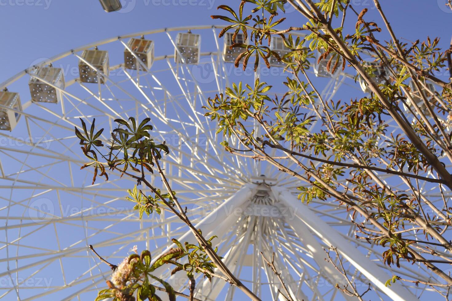 Ferris wheel against a blue sky background. photo