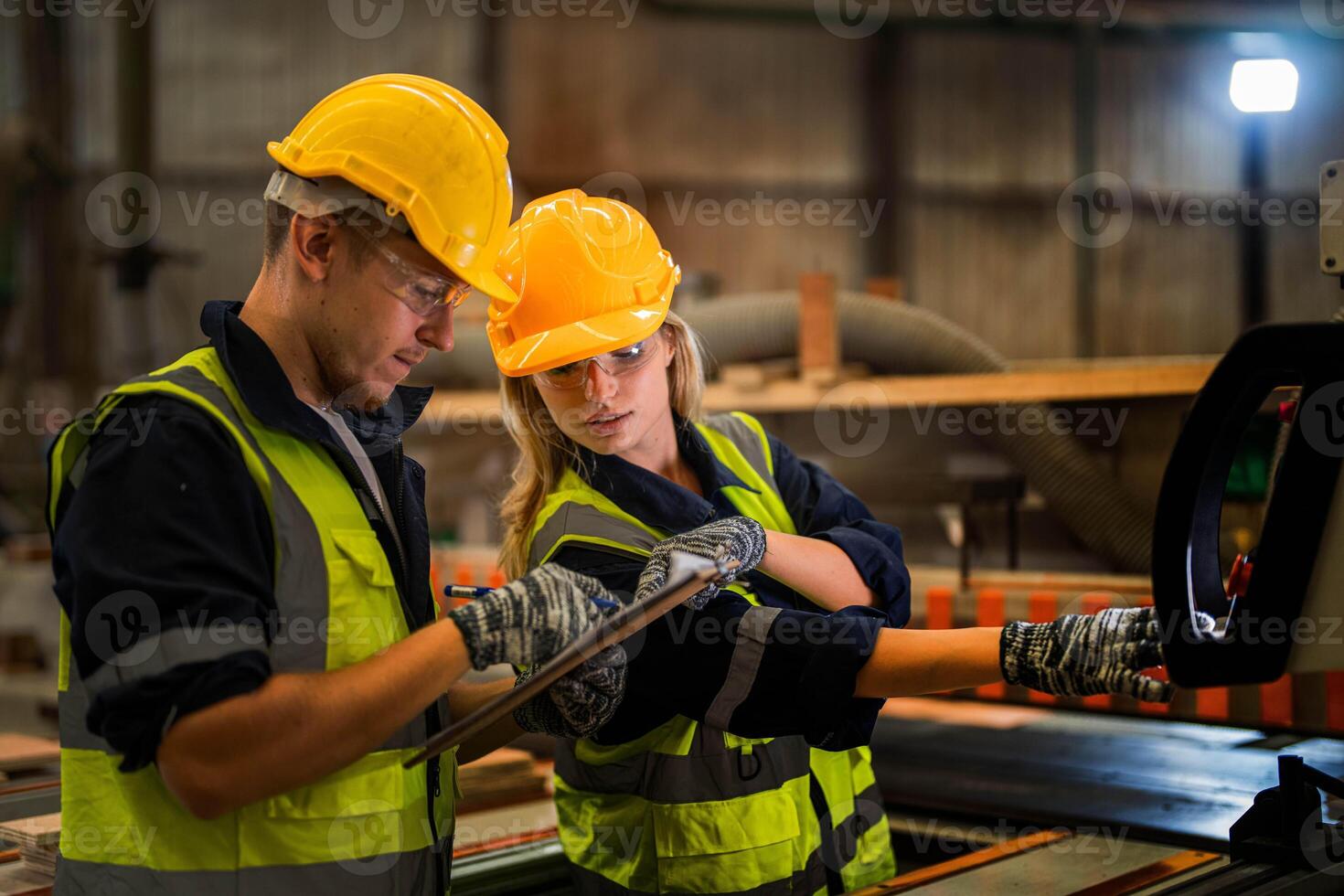 actory engineer workers standing to control panel switch. people works at heavy machine at industry factory. with machinery equipment plant technology. smart industry worker operating. photo