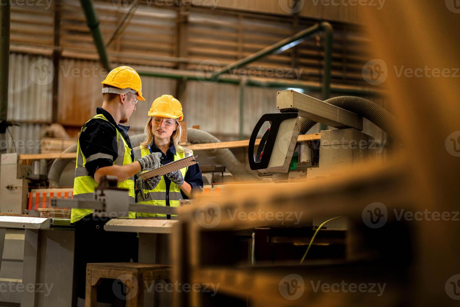 actory engineer workers standing to control panel switch. people works at heavy machine at industry factory. with machinery equipment plant technology. smart industry worker operating. photo
