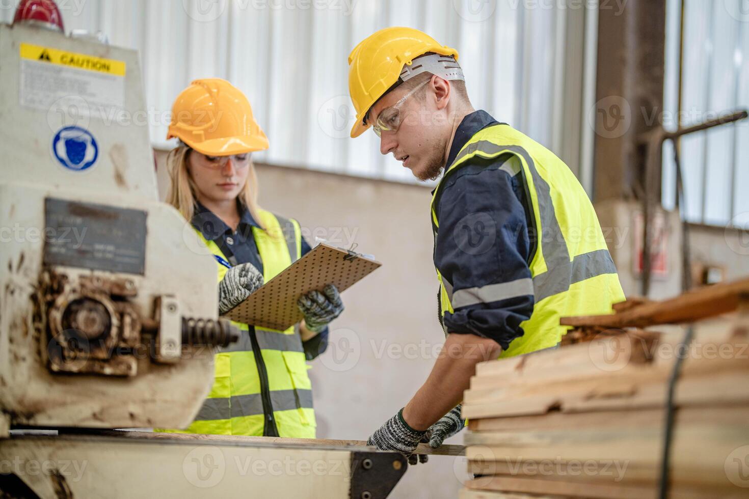 worker carpenters working in machines to cut wood timber. man and woman are crafting with wood in a workshop. two craftsmen or handymen working with carpenter tools or electric machines. photo