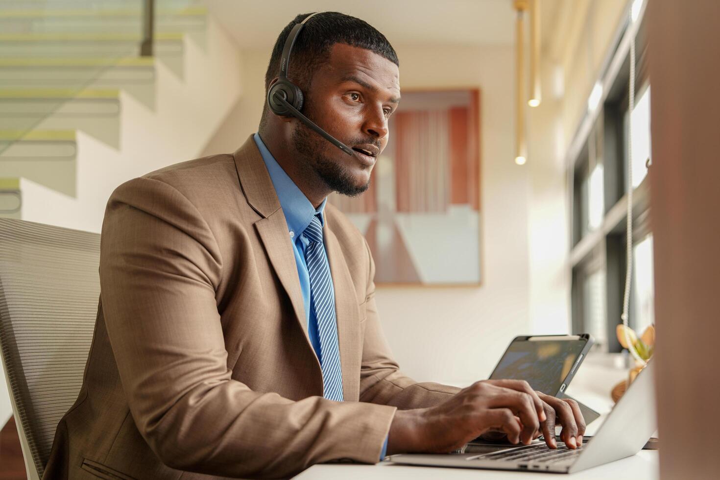 Asian operator working in office. Young friendly operator woman agent with headsets working in a call centre. photo